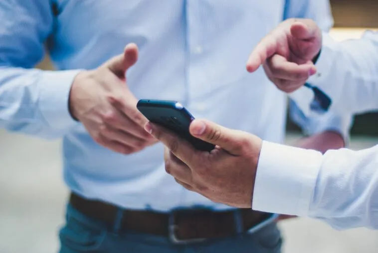 person-holding-smartphone – mobile marketing reads