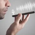 man talking smartphone using the voice recognition – mobile marketing reads