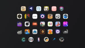 Grid of colorful mobile app icons arranged on a dark background, forming rows and columns, like a home screen. It shows various game and utility icons.