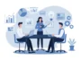 Three colleagues sit around a conference table with laptops while a woman presents a chart.