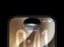 Close-up of a dark-framed smartphone screen showing a curved edge and a large gold '0:41' time overlay near the center top, with the notch and dual front camera at the top.