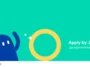 Turquoise banner with a blue cartoon character waving beside a large yellow ring, advertising the Indie Games Fund.